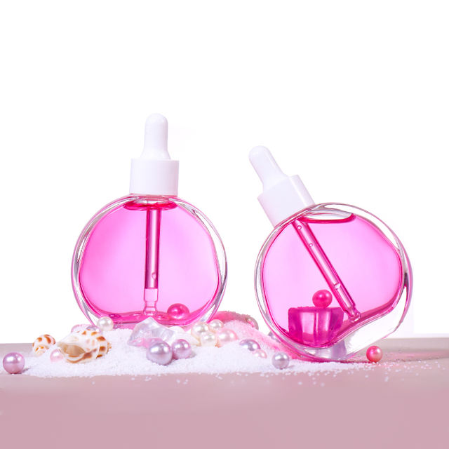 Luxury Custom Transparent Round 60Ml 2Oz Pink Essential Oil Glass Bottles Dropper Body Lotion Matte Glass Bottles