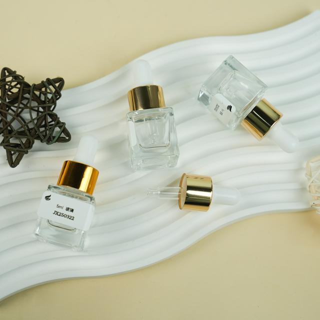 Wholesale Clear Glass Dropper Essential Oil Bottle 5ml Small Sample Lotion Essence Cosmetic Packaging